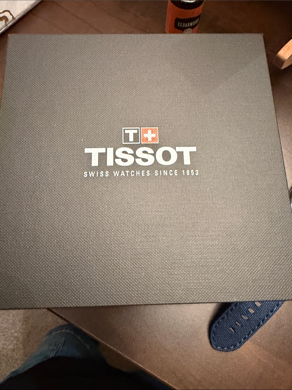 Tissot Black Box with White Logo and Red Cross Accent